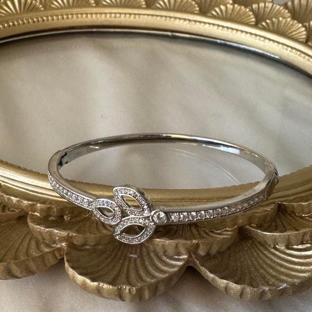Silver bangle with diamond like stones